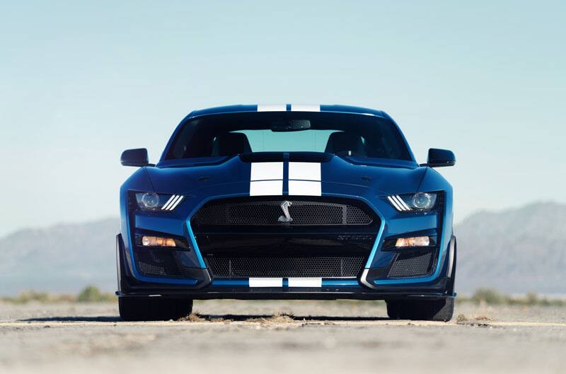 A front end view of a blue Mustang