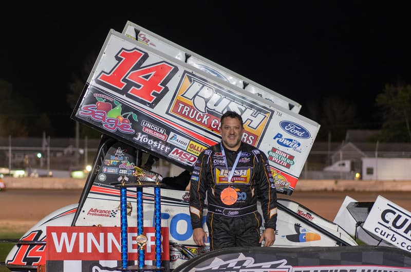 Tony Stewart posing with his Sprint Car