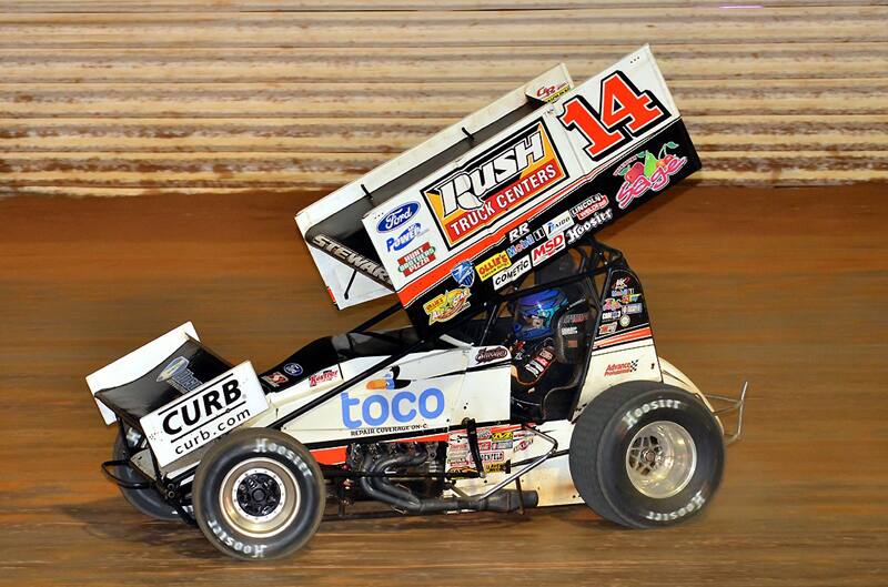 Tony Stewart racing around the dirt track in his Sprint Car