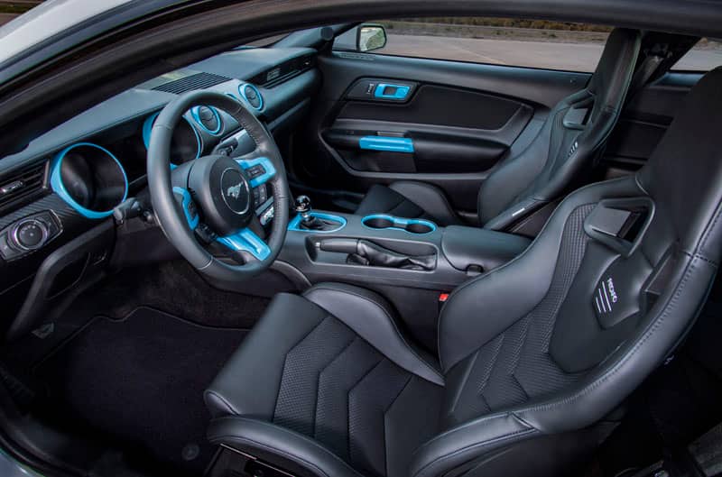 A look at the interior of the white Ford Mustang