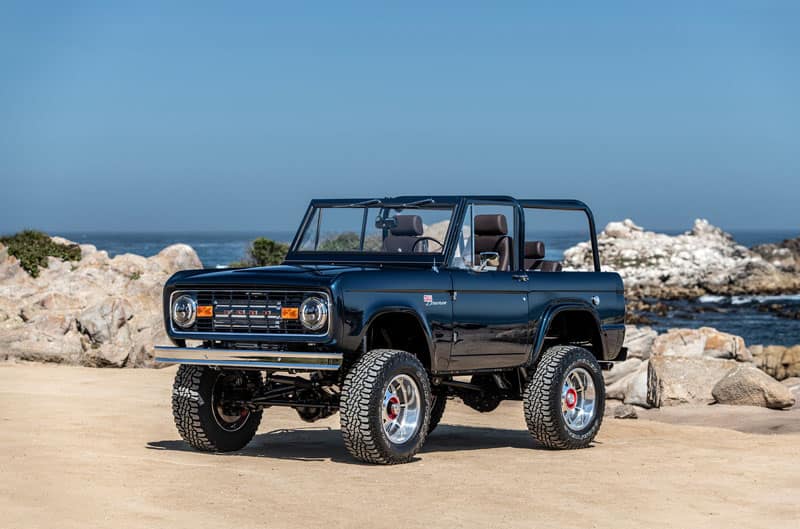 A blue custom Ford Bronco on display