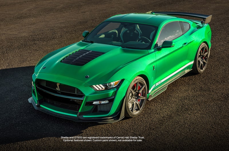 Front profile of a 2020 restoration of a Green Hornet Shelby GT500 parked in a lot