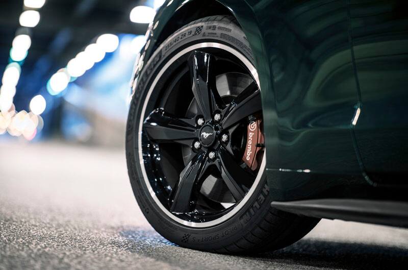 Close up front wheel of green Mustang Bullitt