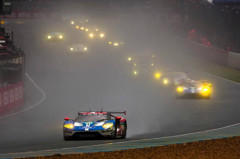 A GT leading the pack on the track.