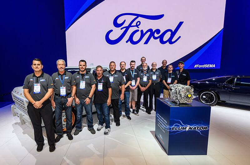 MLE team at SEMA on stage with the eluminator engine