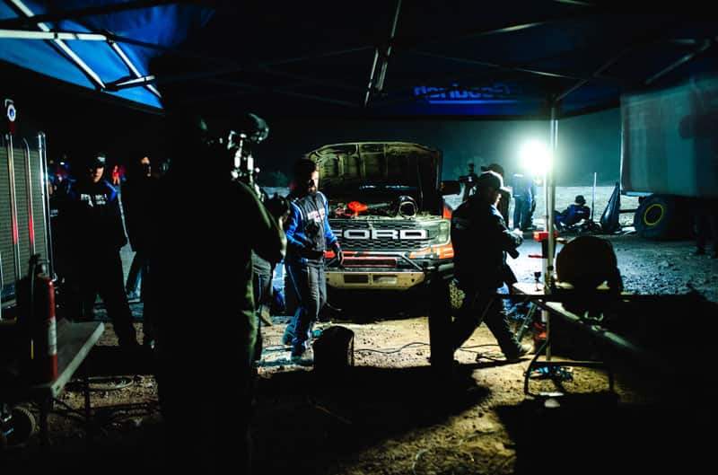 Team working on Ranger Raptor at night