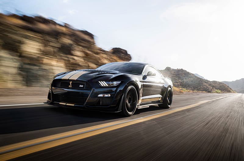 Black Shelby GT500-H on the road at speed