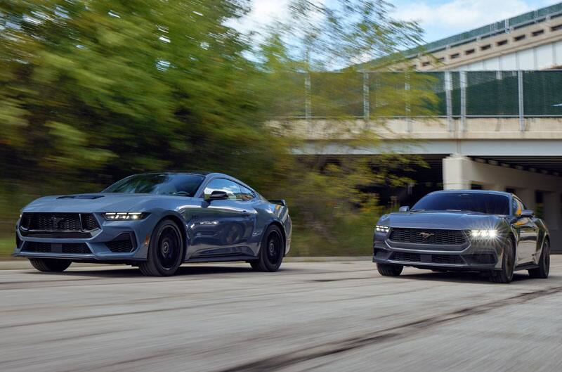 Mustangs at garage