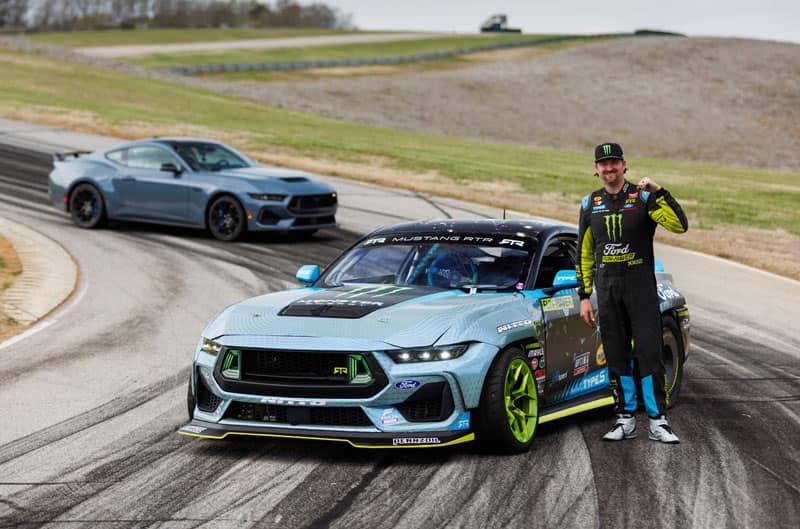 Vaughn Gittin Jr next to Mustangs