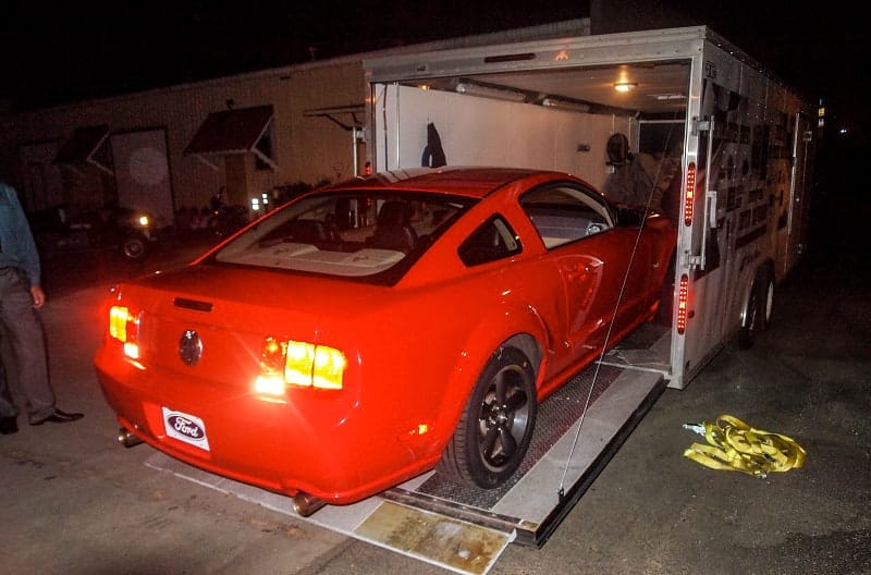 At night, the Red Bullitt is pictured on a ramp connected to a trailer