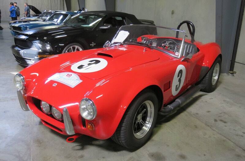 A closeup of a classic red vehicle on display