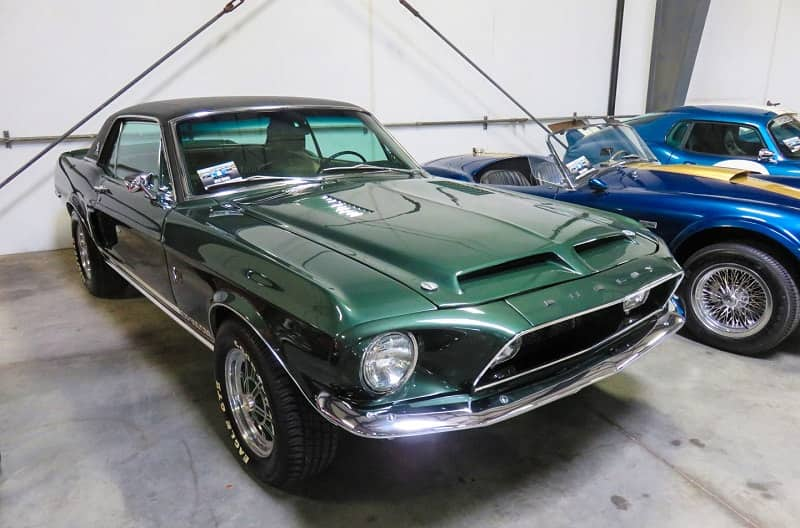 A closeup of a green Shelby Mustang on display