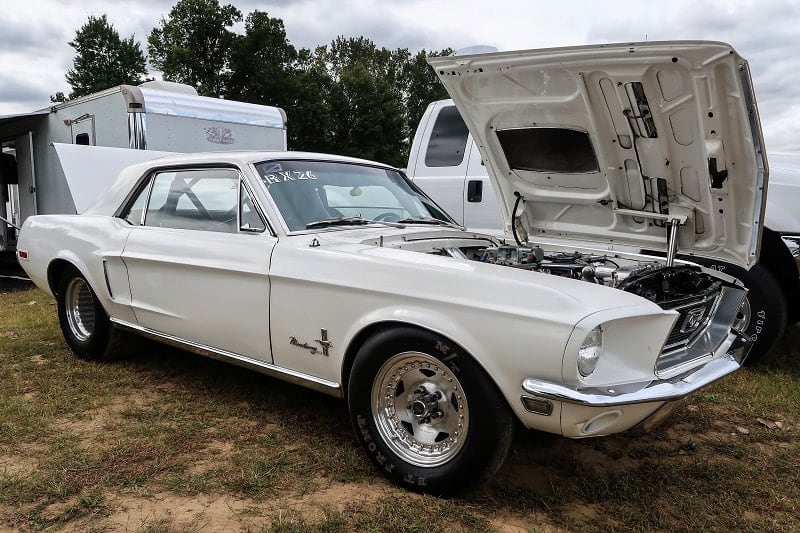 A classic white Ford Mustang on display