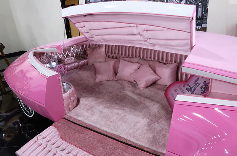 A closeup of the interior of a pink vehicle