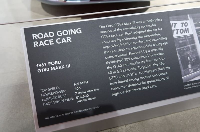 A closeup of the description of a 1967 road going race car on display