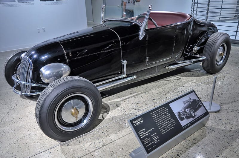 A front side view of a classic vehicle on display