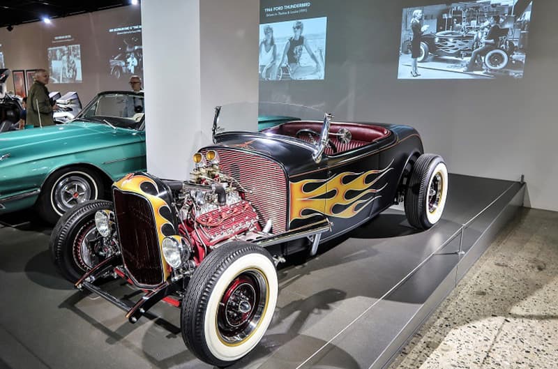 A lineup of classic vehicles on display inside the museum