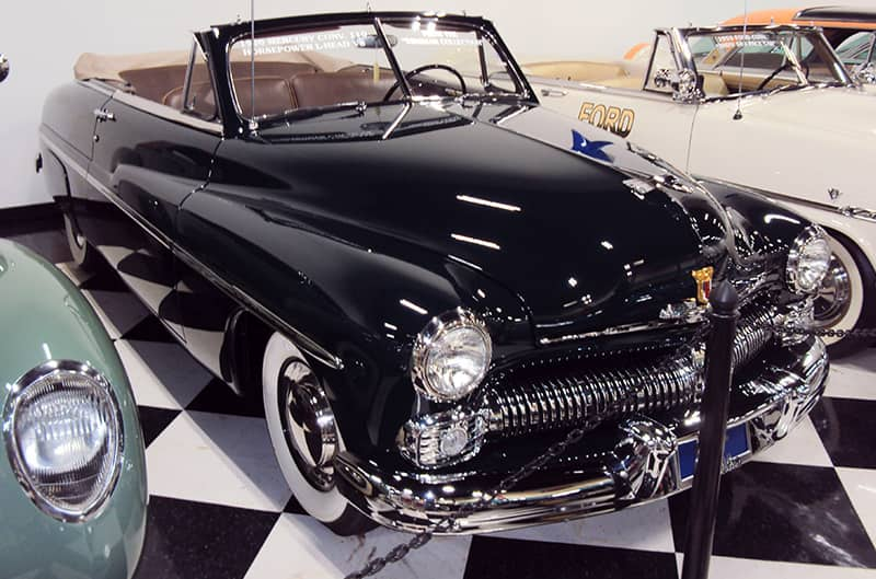 A front side view of a black Mercury on display