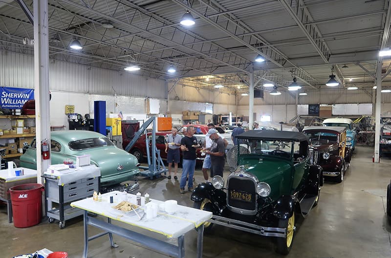 Various classic Fords in a garage