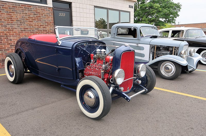 Various classic Fords in parking lot