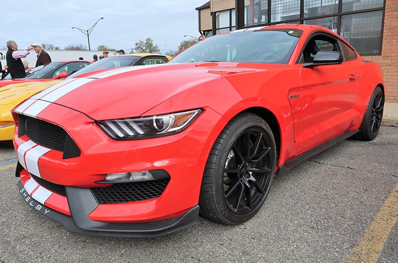 Front profile of a red Shelby Mustang in a parking lot