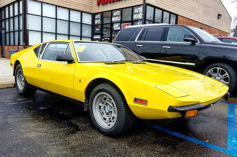 Front profile of a yellow Pantera in the parking lot