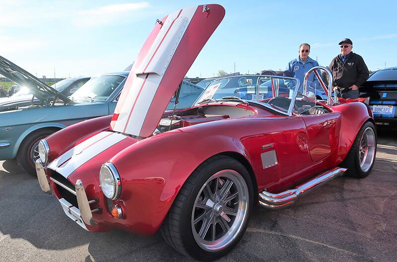 A red and white classic vehicle on display