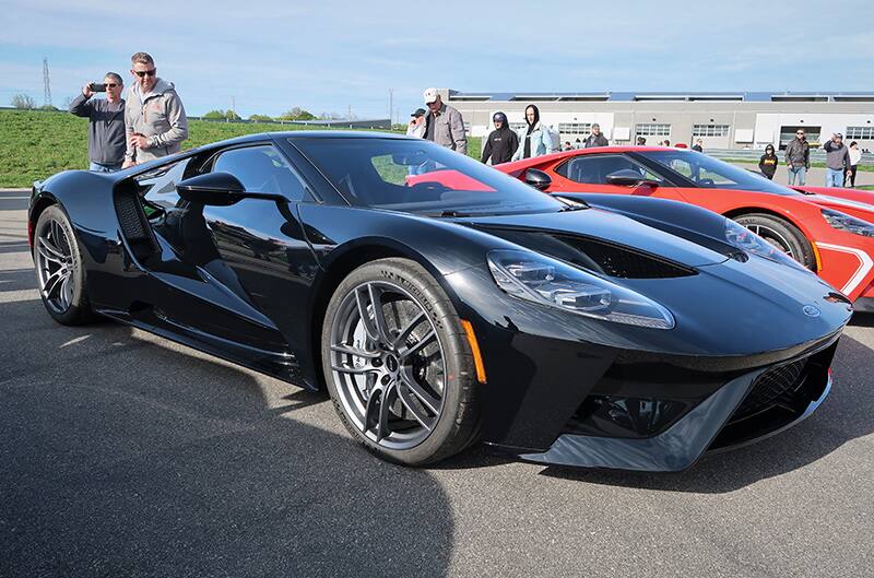 A front side view of a black Ford GT on display