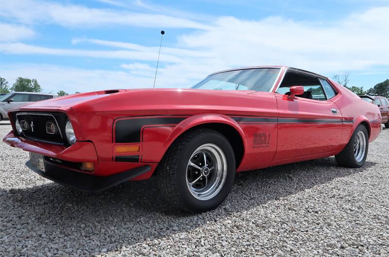 Profile of a red Mach 1 in the parking lot