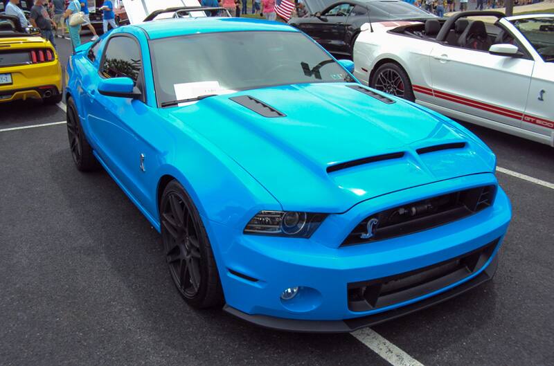 Front of of a blue Shelby Mustang in the parking lot