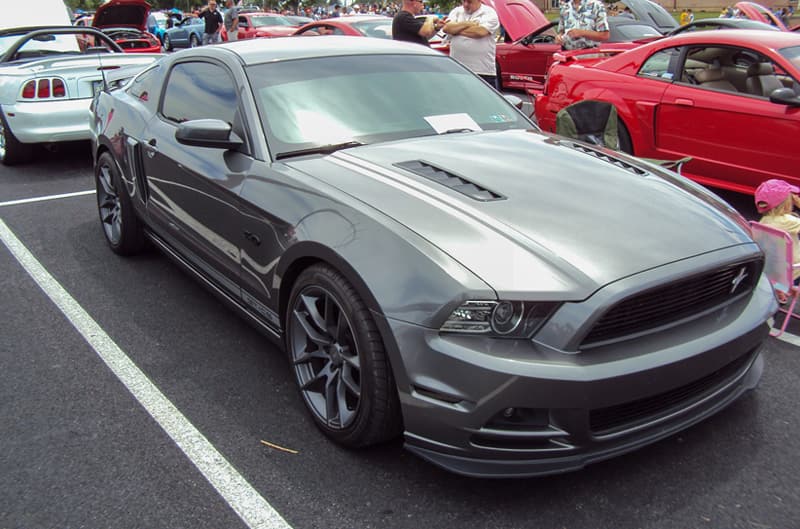 Front of a gray Mustang in the parking lot