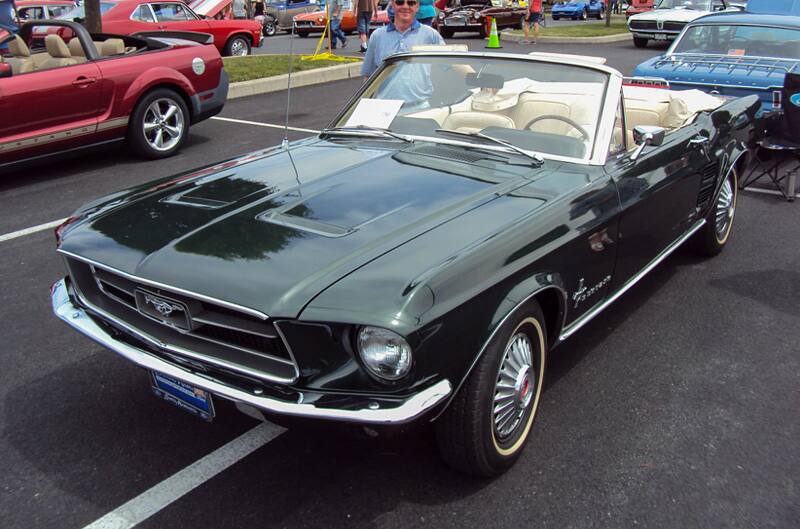 Front of a black Mustang convertible in the parking lot