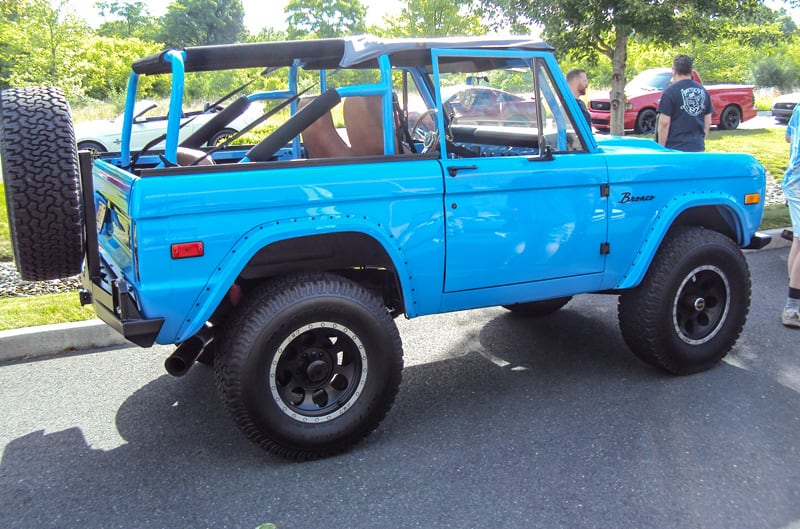 Profile of a blue Bronco in parking lot