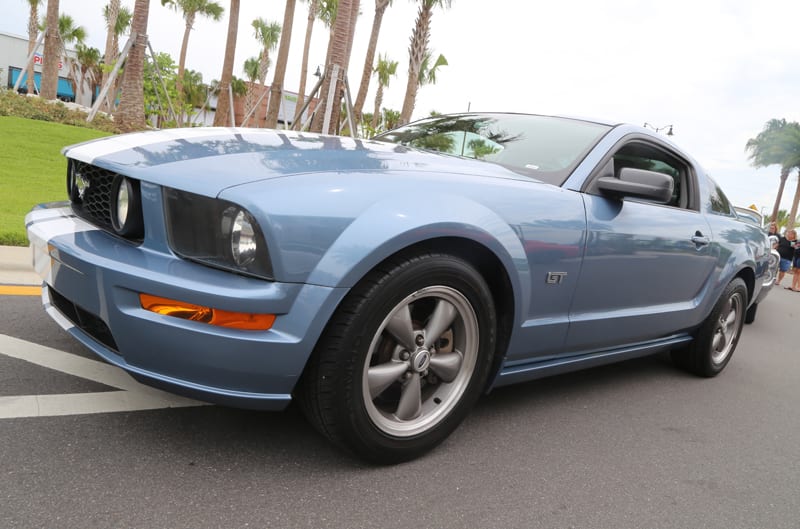 Front profile of a blue Mustang GT in the parking lot