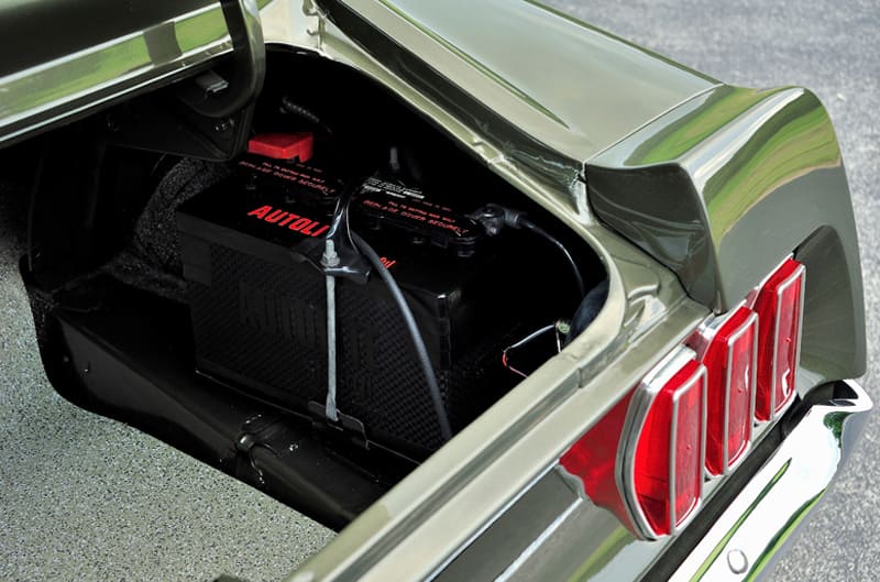 Close up interior of open trunk with car part inside