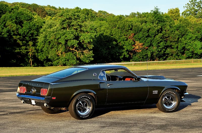 Profile of black Mustang Boss 429 in parking lot