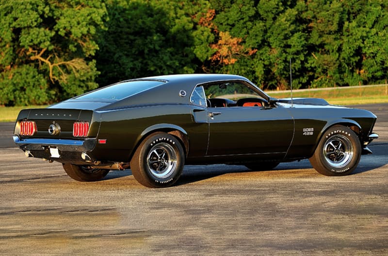 Rear profile of black Mustang Boss 429 in parking lot