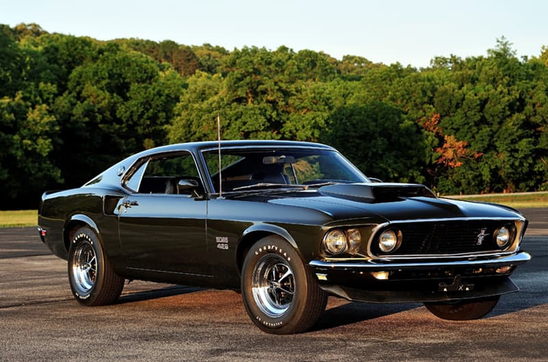 Front profile of black Mustang Boss 429 in parking lot