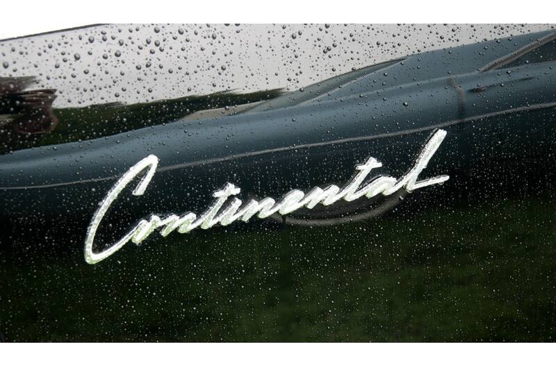 A closeup of the Continental insignia on the side of a vehicle