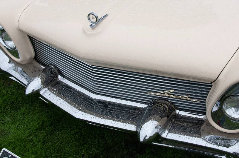 A closeup of the front end of a classic Lincoln vehicle