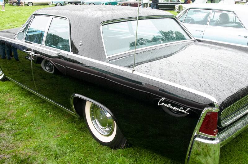 A closeup of a black Lincoln Continental on display