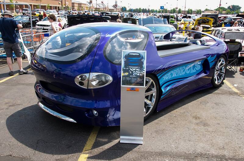 A blue Hot Wheels car on display