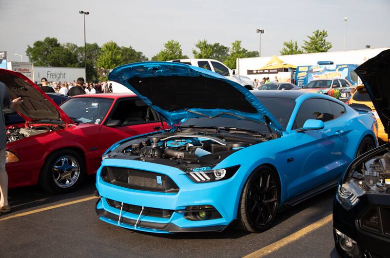 A blue Mustang on display