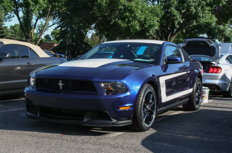 A blue and white Mustang on display