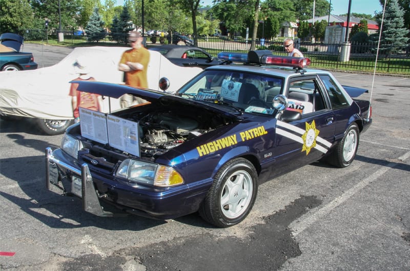 A front side view of a highway patrol vehicle on display