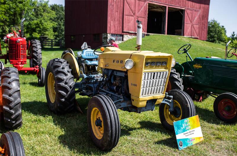 A yellow tractor on display