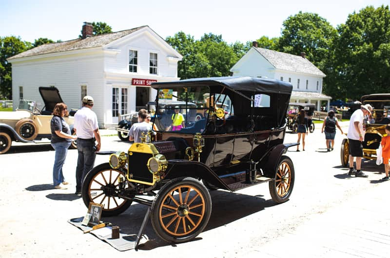 A classic black vehicle on display at the auto fair