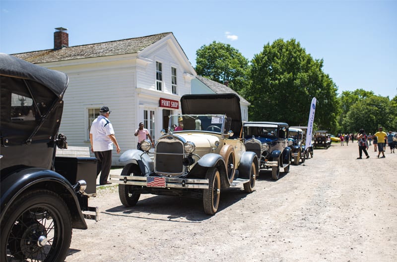 A front side view of a classic vehicle on display