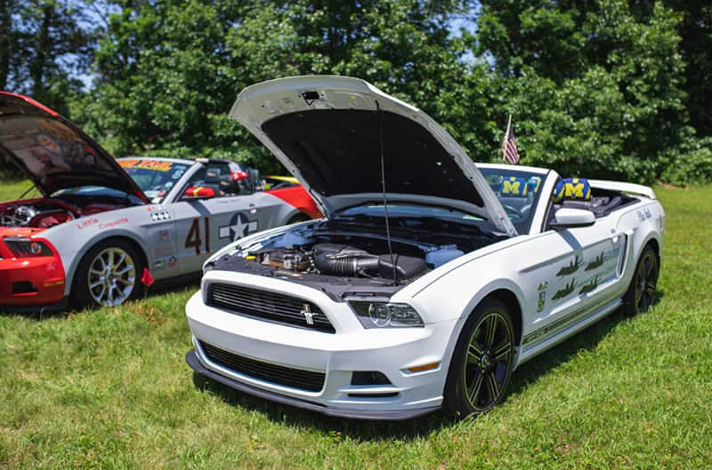 A white Mustang convertible on display