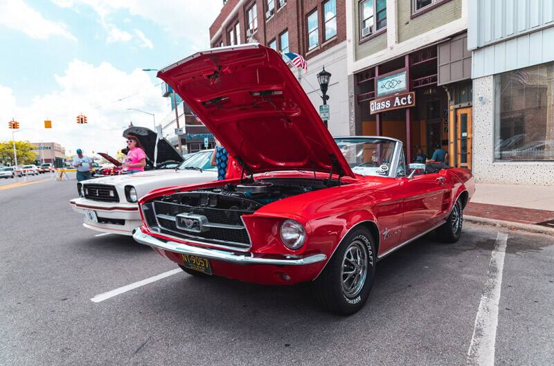 A classic red Mustang convertible on display